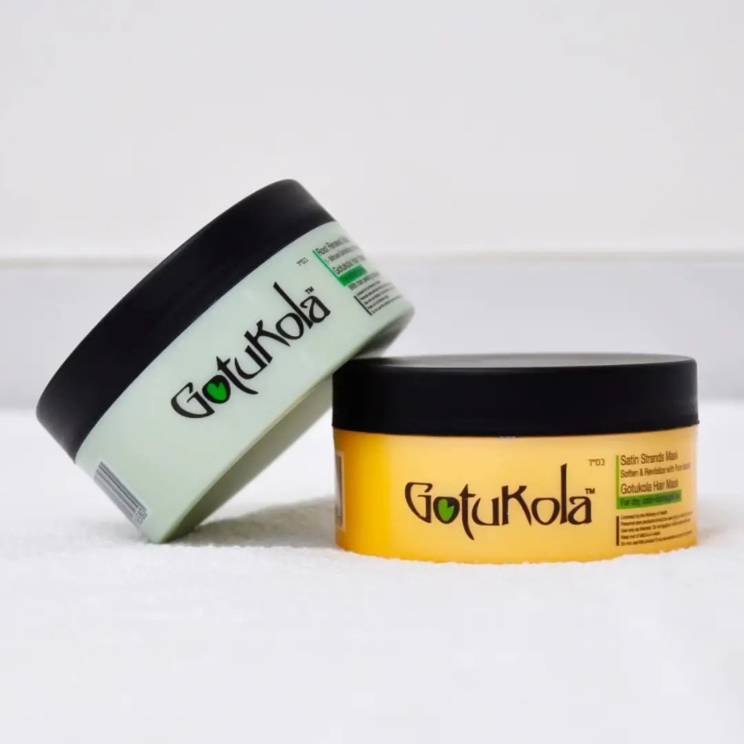 Gotukola Hair Mask and Peeling Capsules on snow, showing contrasting green and yellow containers for nourishing hair treatment.