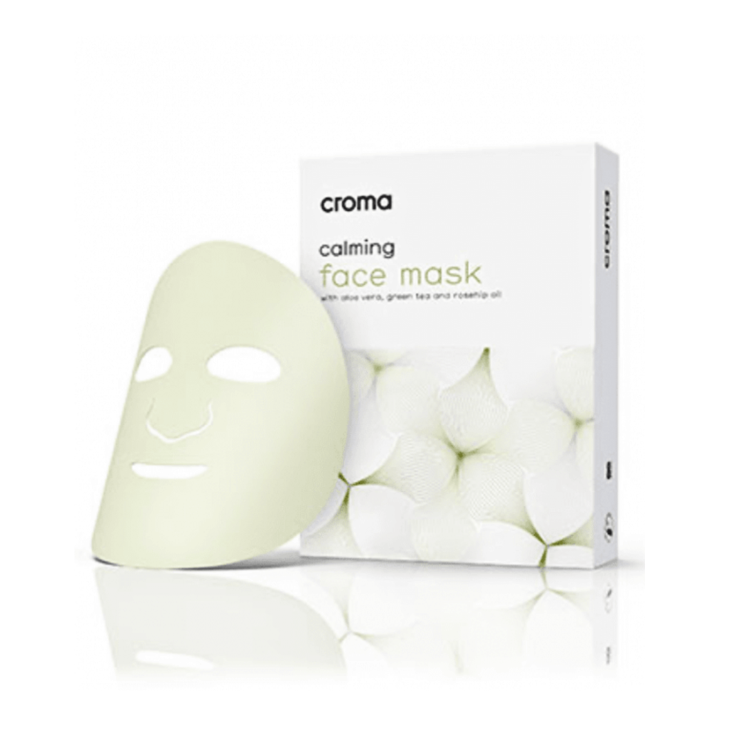 Croma Calming Face Mask box of 8 with a single mask, enriched with aloe vera, green tea, and rosehip oil for soothing and nourishing skin.