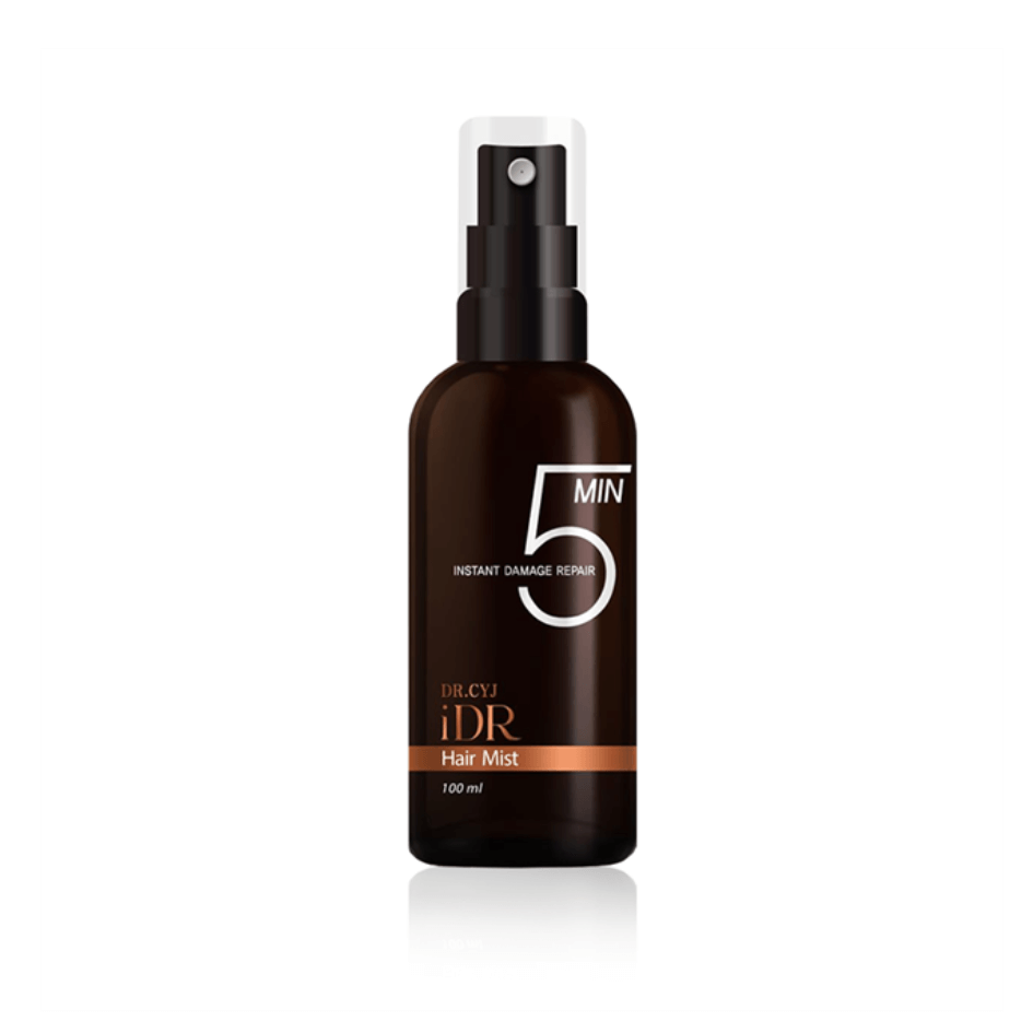 100 ml bottle of Dr. CYJ iDR Hair Mist, dark amber with a prominent '5 MIN' label and orange accents, equipped with a white spray head.