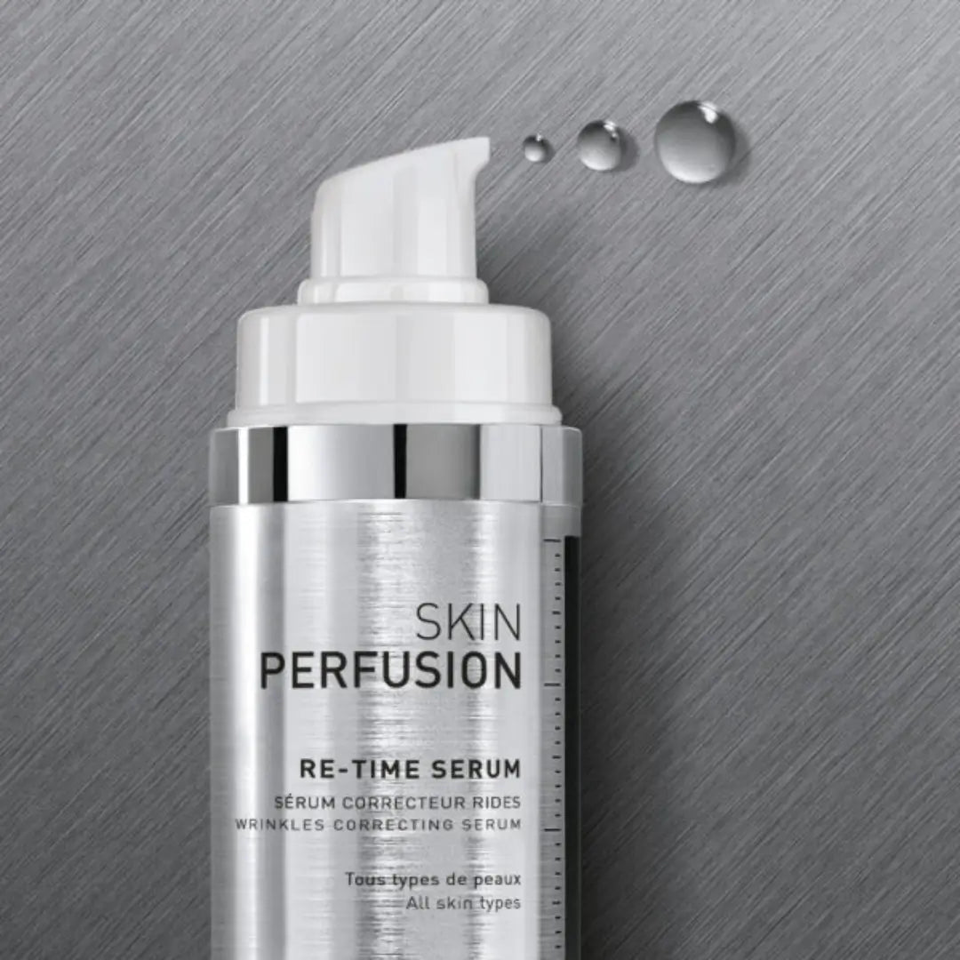 Silver and white bottle of FILLMED Skin Perfusion RE-Time Serum, 30ml, multi-functional anti-ageing, reduces wrinkles, hydrates skin.