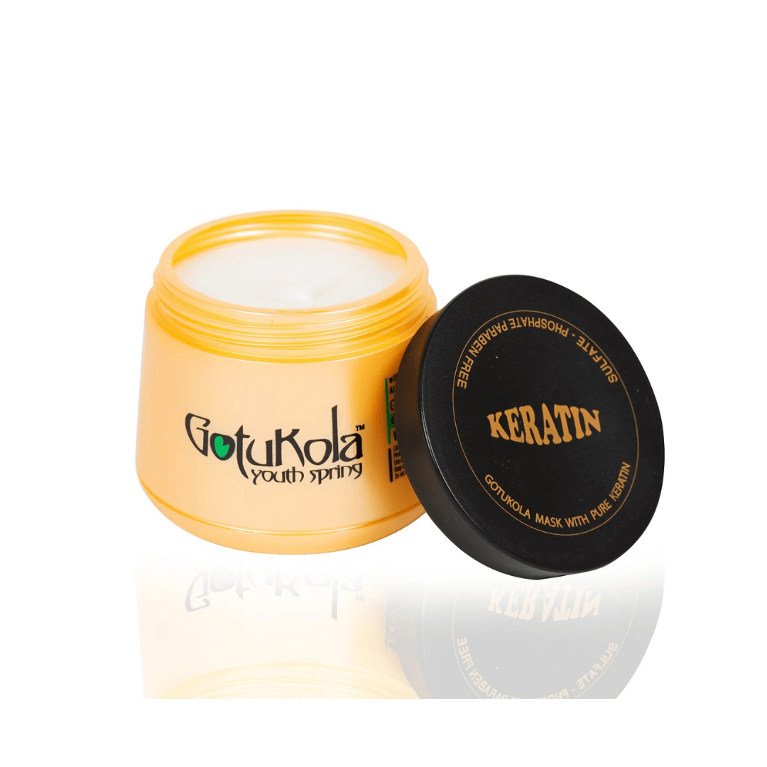 Open jar of Gotukaola hair mask showcasing creamy texture, perfect for restoring softness and strength to hair.