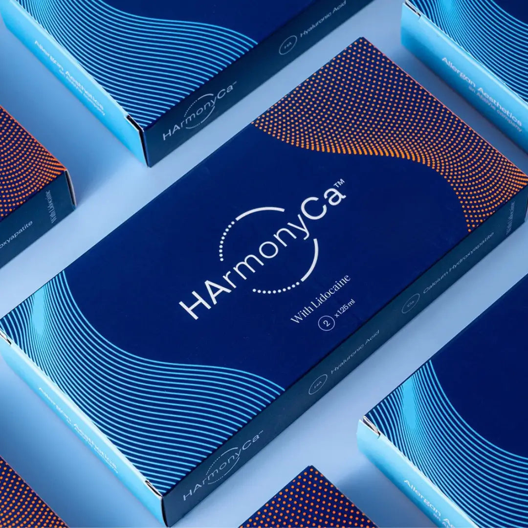 HarmonyCa box design with vivid blue wave pattern highlighting two 1.25ml Lidocaine-infused syringes for skincare.