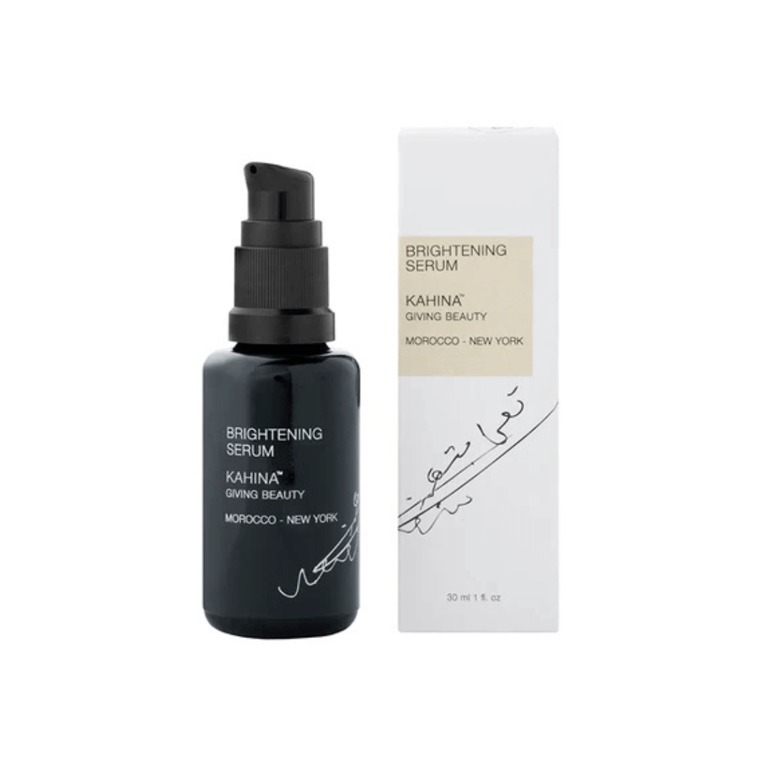 Kahina Brightening Serum bottle displayed with its packaging box, emphasizing its natural ingredients for skin tone refinement and radiance.