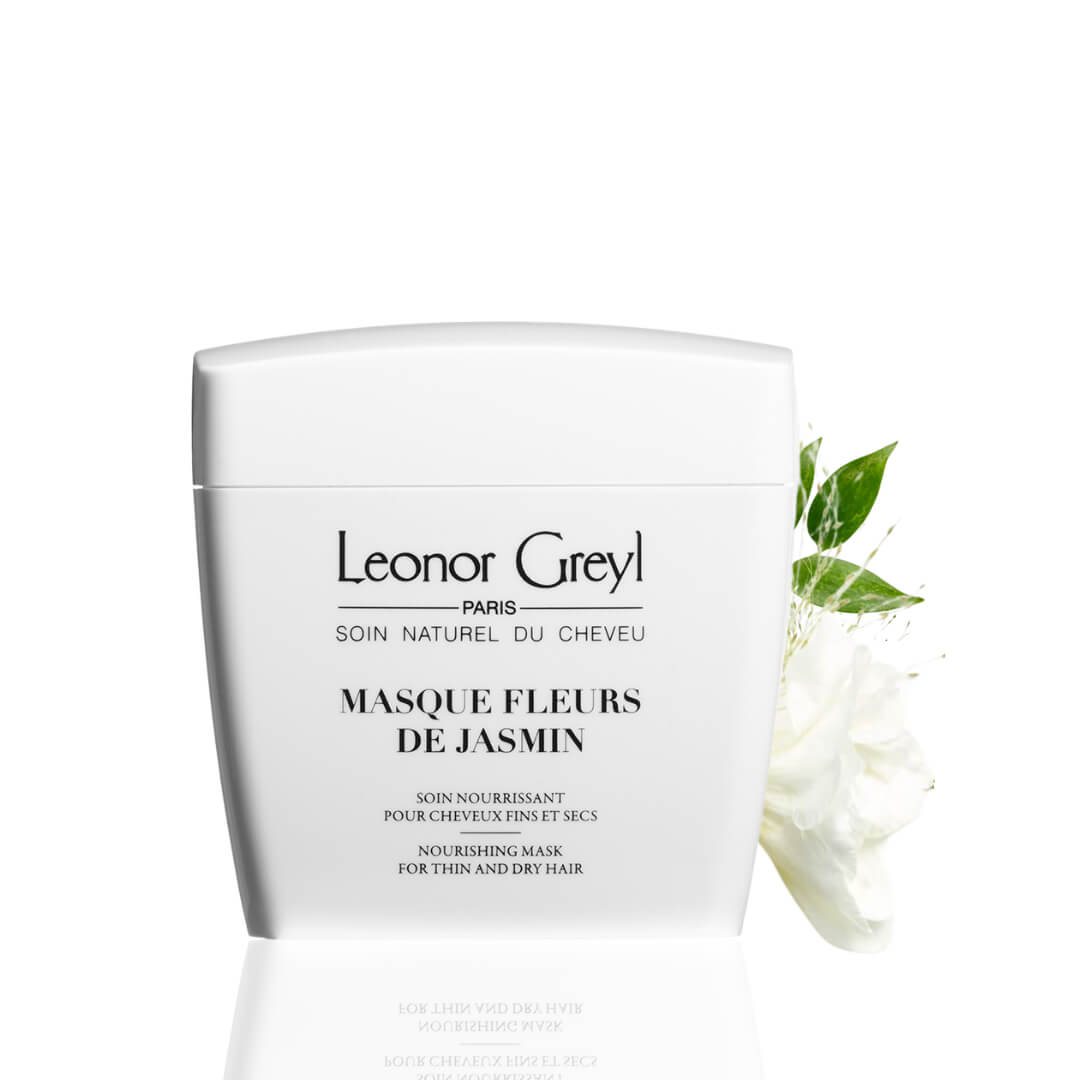 Leonor Greyl Masque Fleurs De Jasmin container, featuring jasmine flowers, designed to hydrate and nourish fine, dry hair without weighing it down.