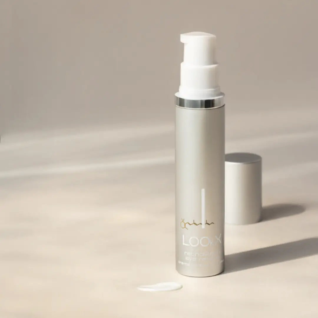 Lookx Retinol2ndG Eye Rescue in a sleek silver airless pump bottle, elegantly positioned in a natural setting with a drop of cream.