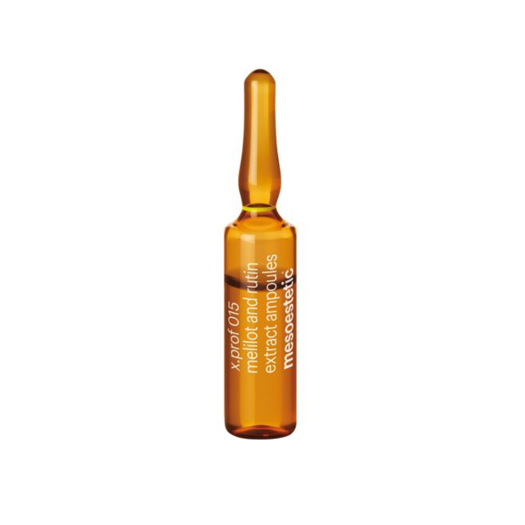 a close-up of a single 2ml ampoule of Mesoestetic X.Prof 015 Melilot and Rutin Extract, used for microcirculation.