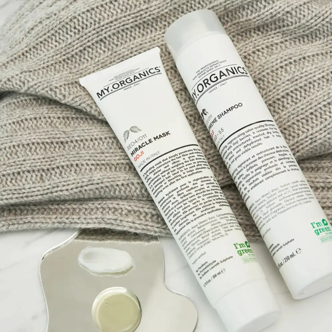 My Organics Miracle Mask and Supreme Shampoo tubes on a knitted fabric, 200ml hair mask for hydration and shine.