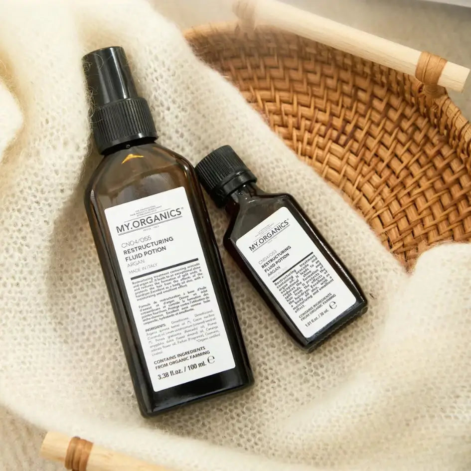 My Organics Restructuring Argan Oil 30ml and 100ml bottles placed in a woven basket.