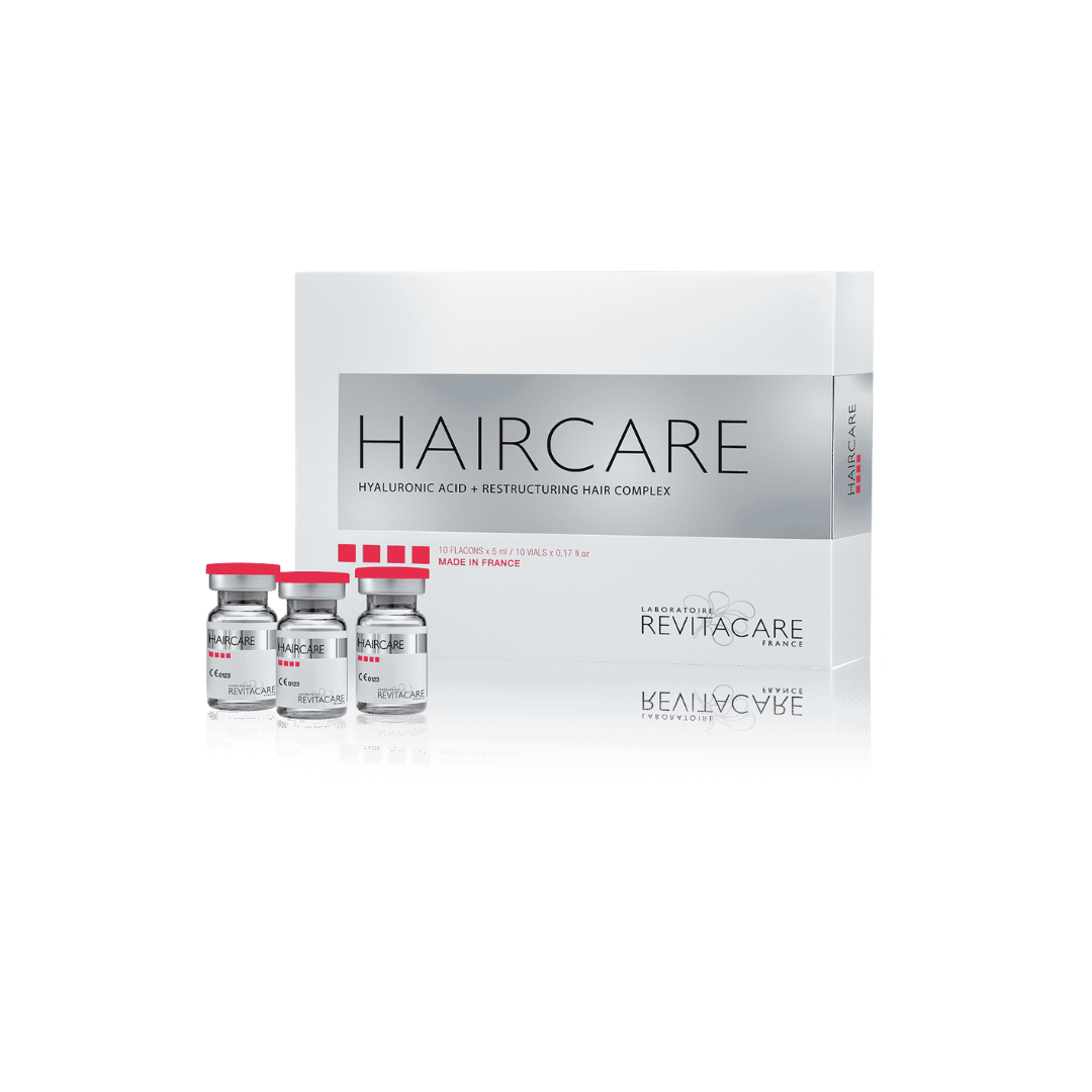 Box of Revitacare Haircare with 10 vials, each 5ml, displayed on a reflective surface, enhance hair quality and reduce hair loss.