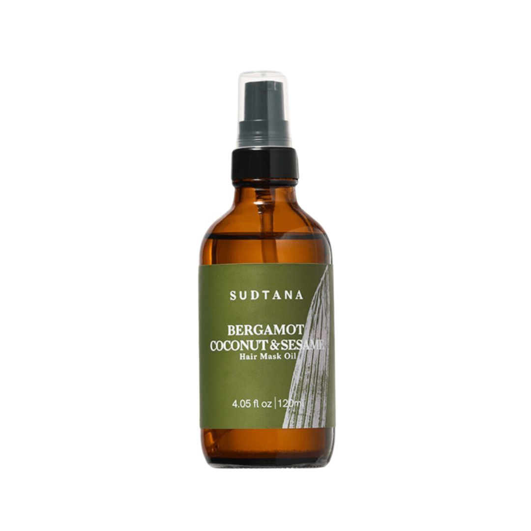 Sudtana bergamot, coconut & sesame hair mask oil in spray bottle, for deep hair nourishment.