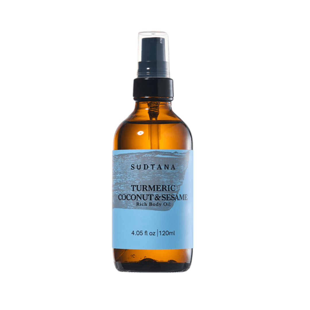 Sudtana Turmeric Coconut & Sesame body oil in amber spray bottle, rich hydration formula.