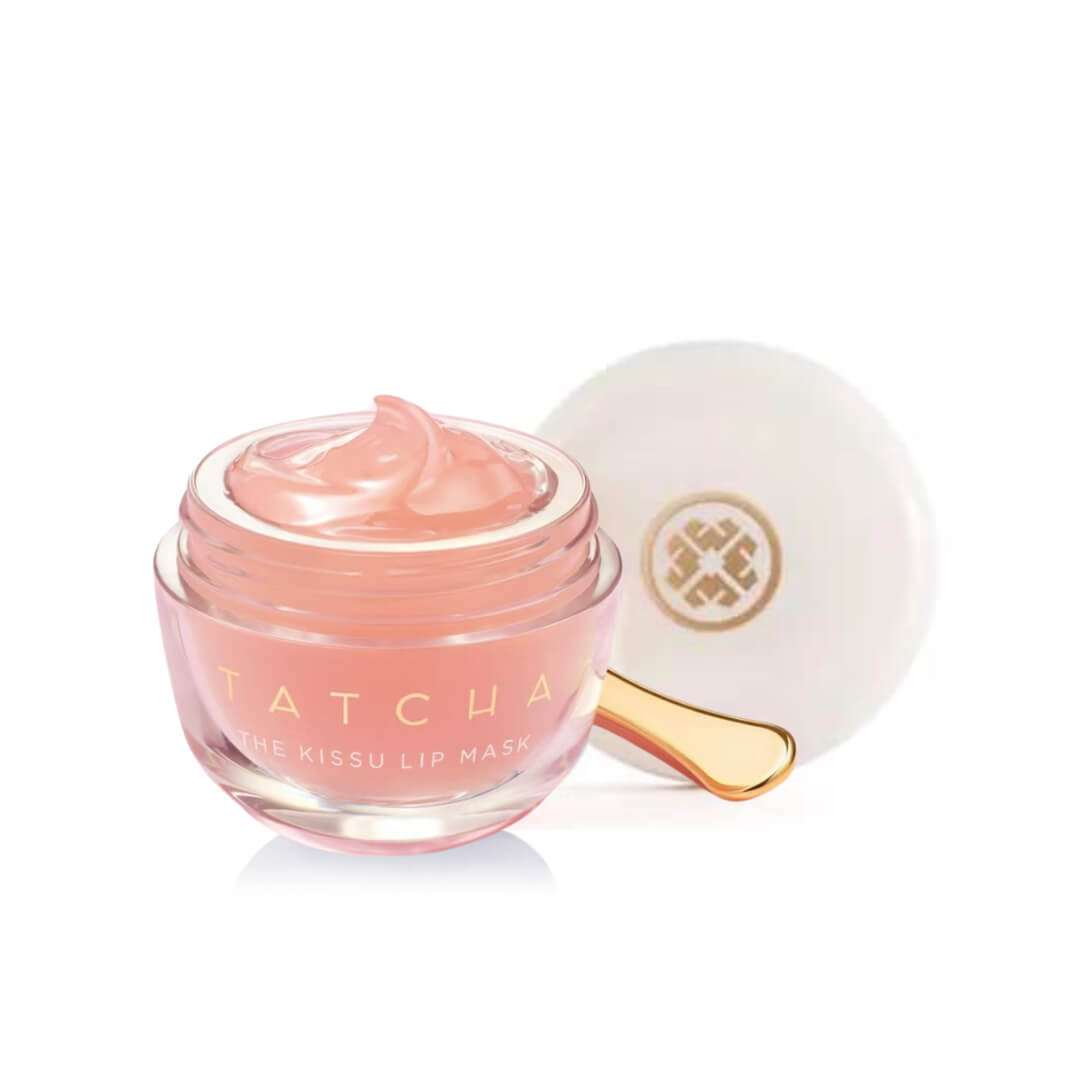 Open jar of Tatcha The Kissu Lip Mask, showcasing its jelly texture and included gold spatula.