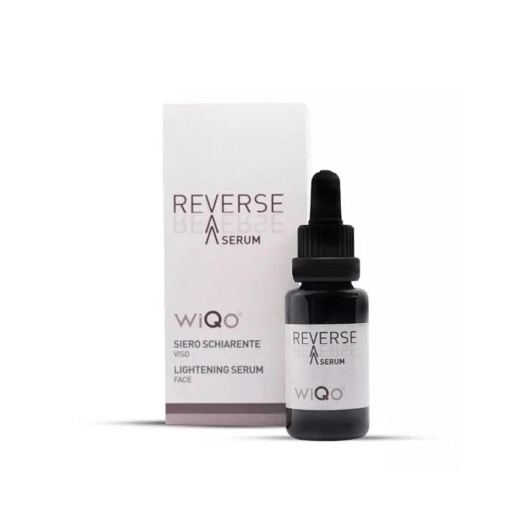 WiQo Reverse Lightening Serum, 20ml dark bottle with dropper and box, designed to target signs of aging and uneven skin tone.